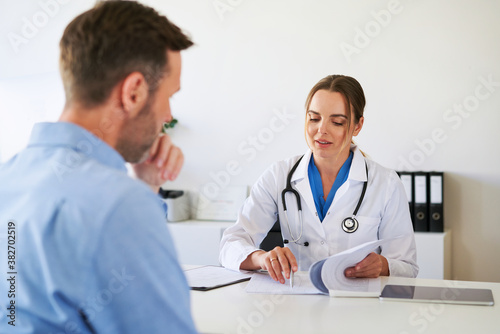 Doctor and patient talking at doctorÕs office