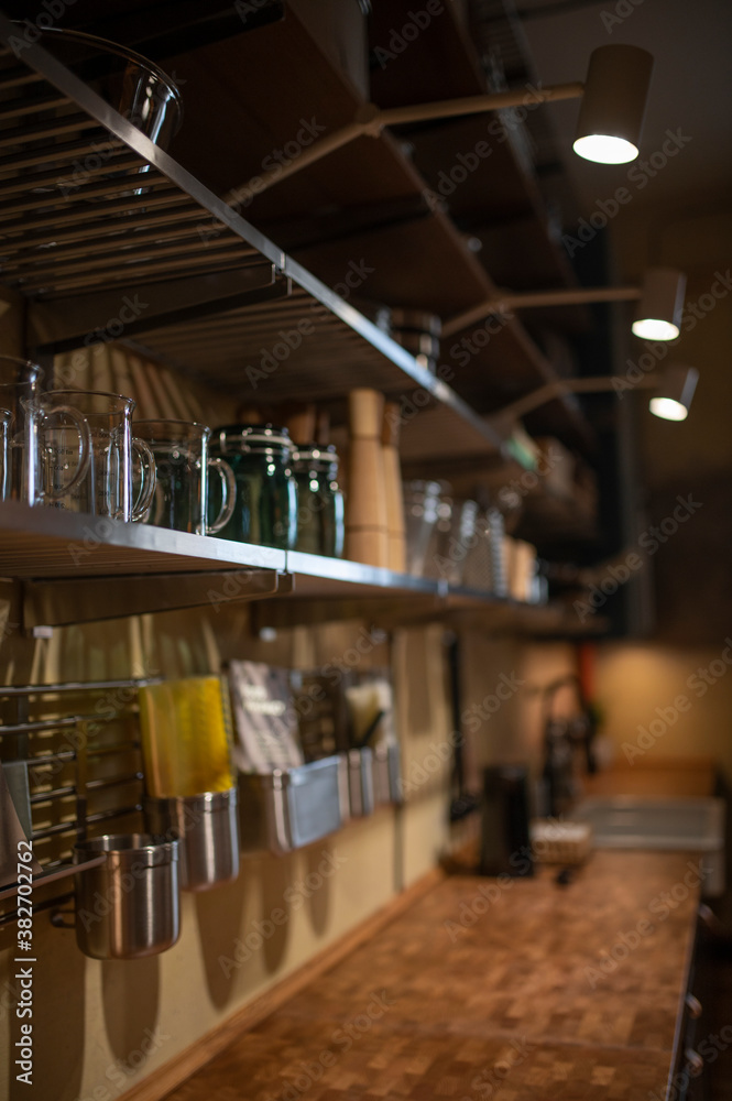 Part of the kitchen interior with wooden shelves and dishes Part of the kitchen interior with wooden shelves and dishes