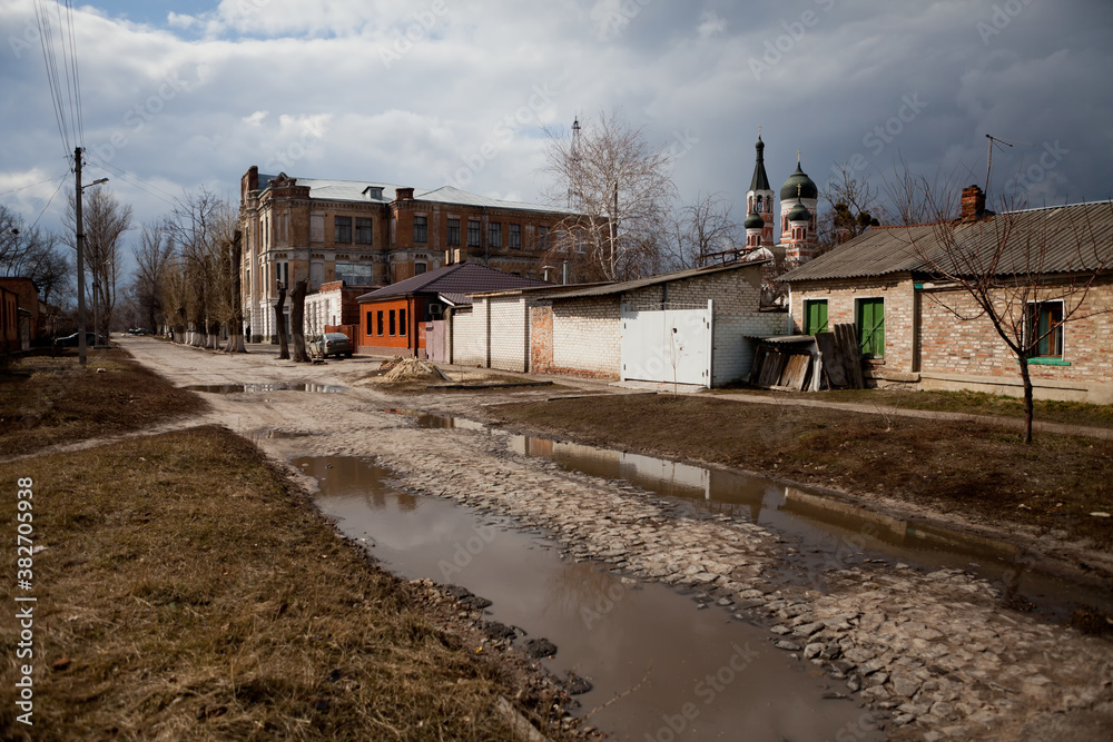 Fototapeta premium Puddles outside on a sunny spring day