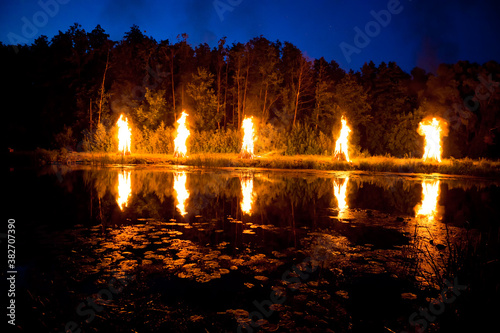 Bonfires on the river on the holiday of Ivan Kupala