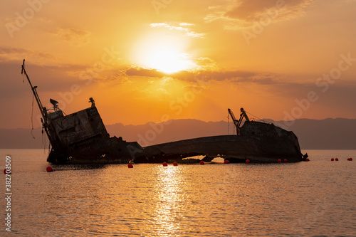 Sunset view of shipwreck in the Gulf of Aqaba off the Saudi Arabian coast, Haql Province photo