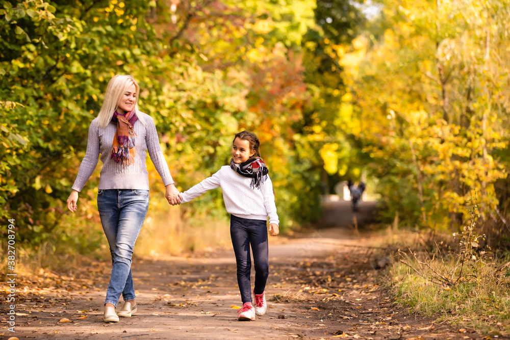 Young mother and her toddler girl have fun