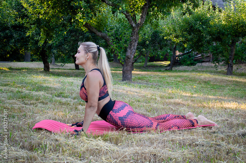 woman doing yoga exercises in the park