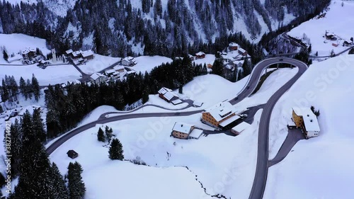 winter landscape with snowy street in the mountains. Huts in the Alps and vallay view. 