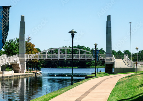 a bridge over the Woodlands Waterway in Texas. photo