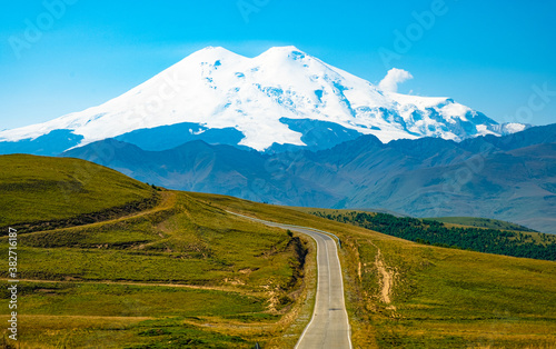 A road on the background of mountains. Highway to Elbrus, landscape. Caucasus, Russia