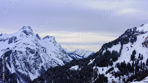 snow covered mountains in winter. Rural areal in the alps. Vallay and sky view in germany