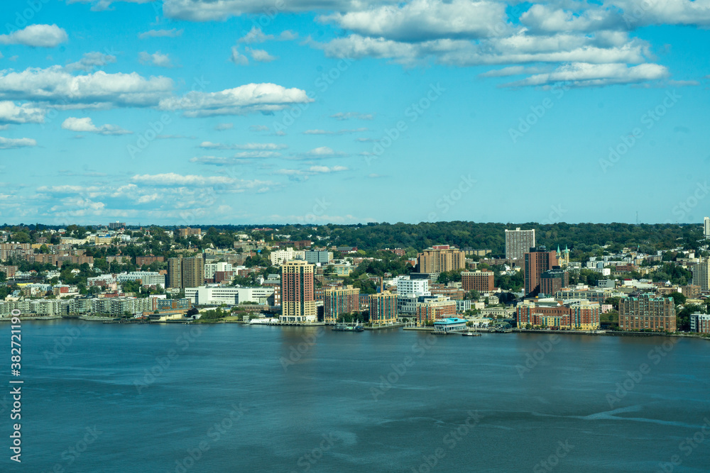 Yonkers, NY / United States - Oct. 6, 2020: a wide landscape view of Yonker's historic waterfront, made up of restaurants, shops and residential buildings.