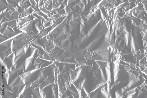 Silver shiny wall abstract background. Crumpled luxury metallic foil texture.