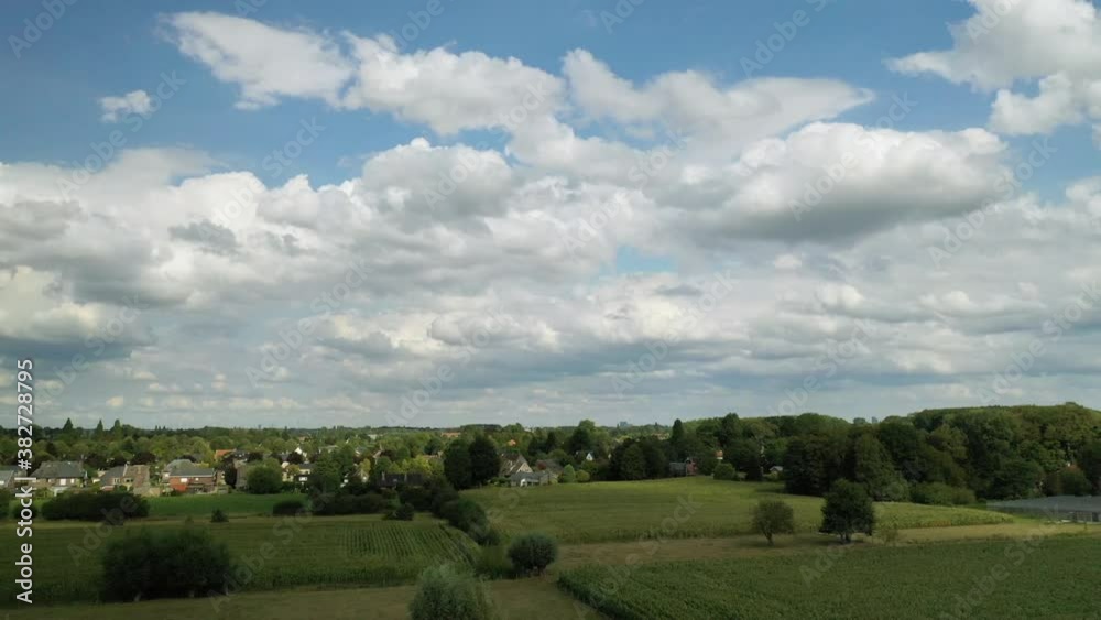 Aerial, panning, summer fields and cloudscape outside of Gent, Belgium Aerial, panning, summer fields and cloudscape outside of Gent, Belgium