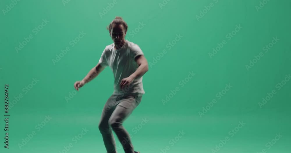 Studio, green screen, a silhouette of a young modern dancer, London, UK Studio, green screen, a silhouette of a young modern dancer, London, UK