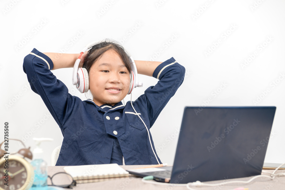 Cute and happy little girl children wear headphone and using laptop computer, Cute and happy little girl children wear headphone and using laptop computer,
