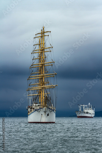 sailboat at anchor in cloudy weather