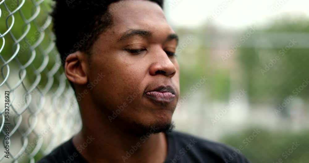Stressed African man thinking outside. young black guy having doubts Stressed African man thinking outside. young black guy having doubts