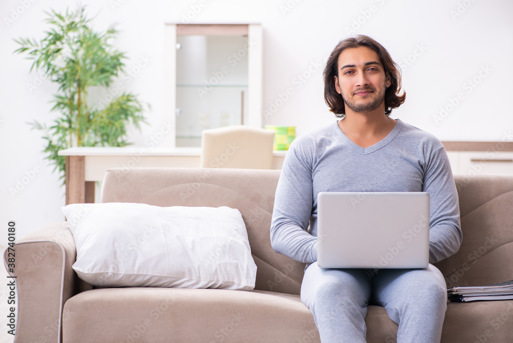 Young male employee freelancer working from home Young male employee freelancer working from home