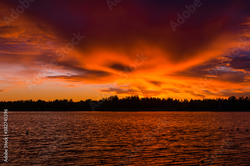 Gorgeous landscape at sunset on a magnificent forest lake