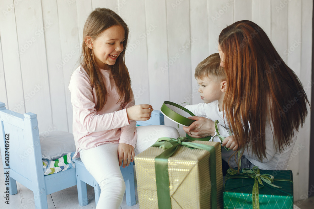 Mother with child. Family at home. People with presents. Mother with child. Family at home. People with presents.