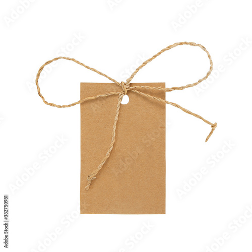 Brown paper blank label with straw rope isolated on white with clipping path