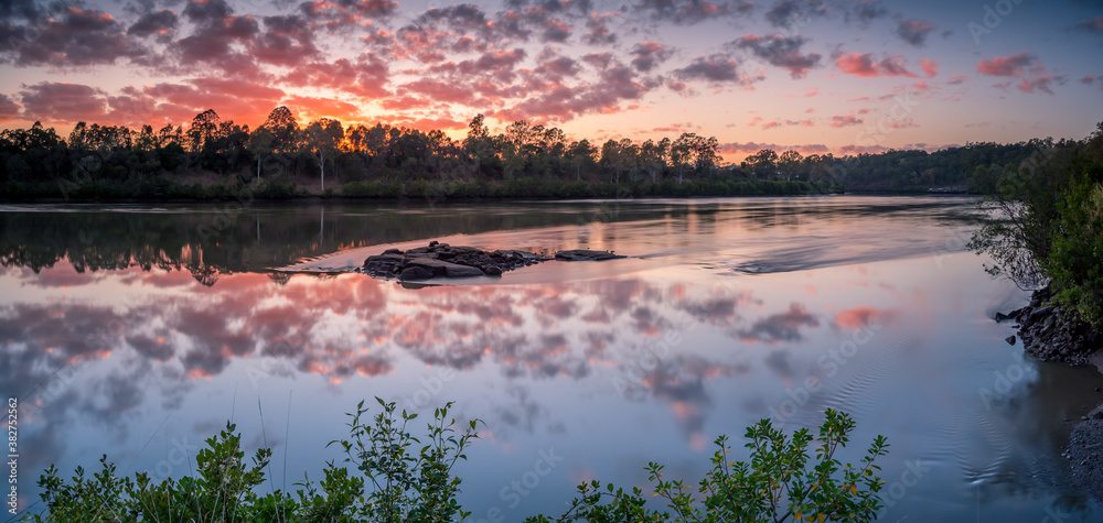 Panoramic Riverside Sunrise with Reflected Cloudscape