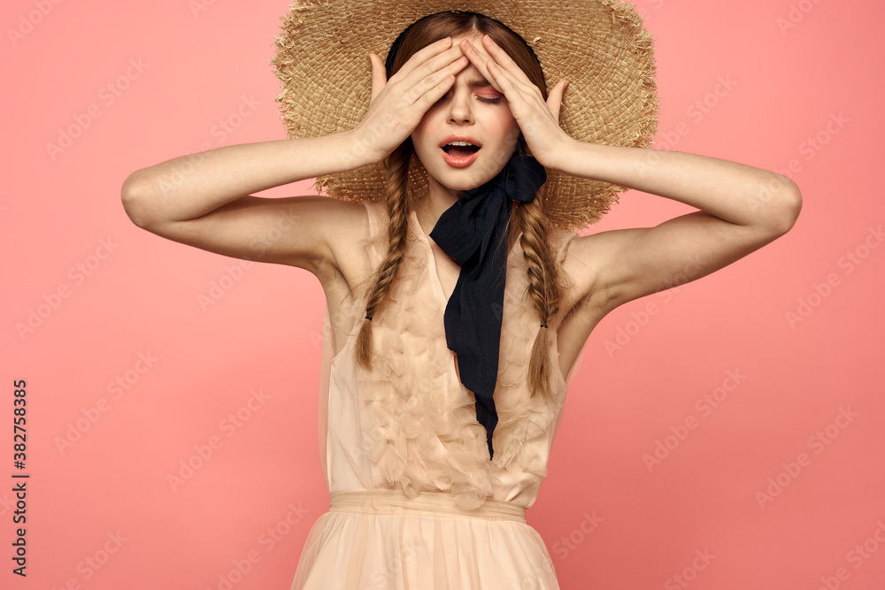 Romantic girl with pigtails and in a straw hat smile romance pink background Copy Space Romantic girl with pigtails and in a straw hat smile romance pink background Copy Space