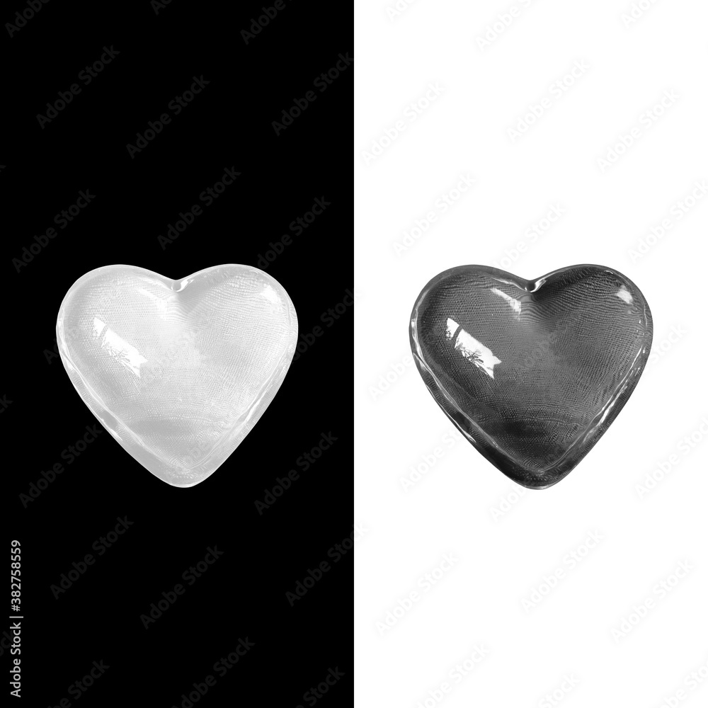 Glowing crystal white heart isolated on black background and black heart isolated on white background with clipping path. Balance of love and life concept.