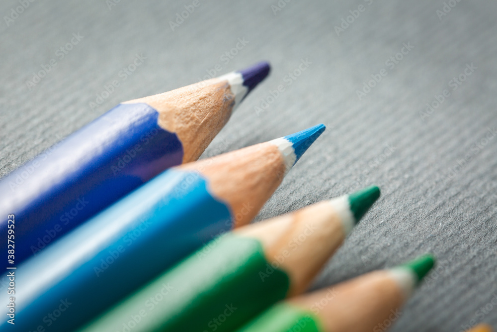 colored pencils on gray background close-up colored pencils on gray background close-up