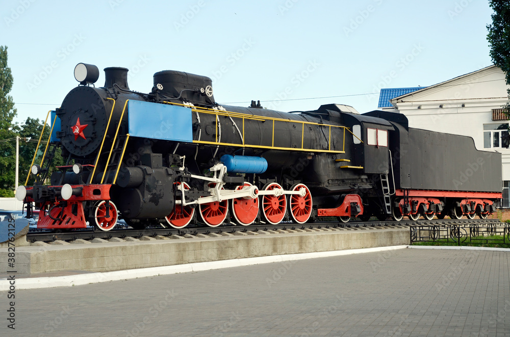 Fototapeta premium old locomotive as a monument