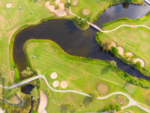 Aerial view green grass golf course field with river