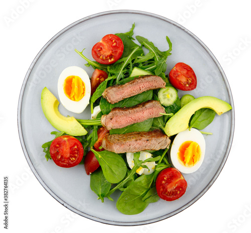 Healthy salad with beef cherry tomatoes and boiled egg.