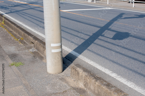Wallpaper Mural shadow of utility pole reflected on the road Torontodigital.ca