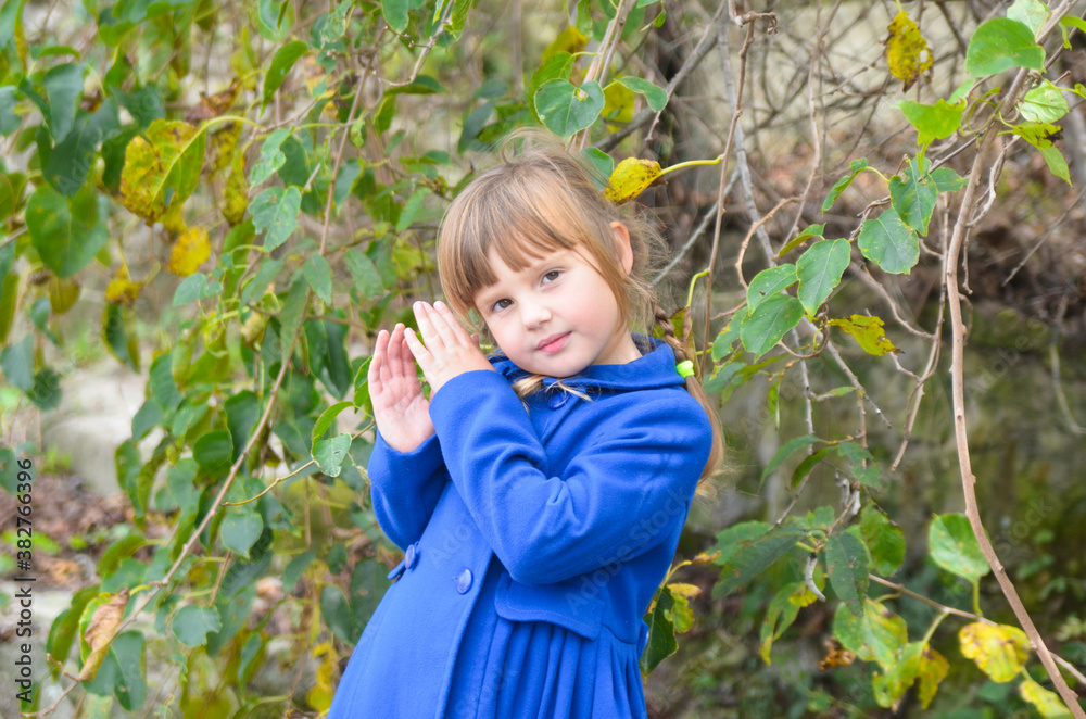 Beautiful portrait caucasian child in autumn forest Beautiful portrait caucasian child in autumn forest