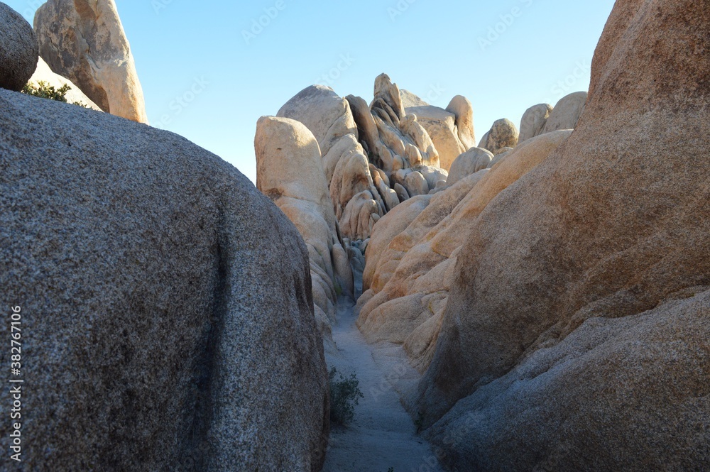 Afternoon tight hike in dramatic rock formation in Joshua Tree National Park