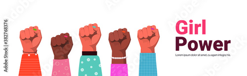 mix race raised up women's fists female empowerment movement girl power union of feminists concept copy space horizontal vector illustration