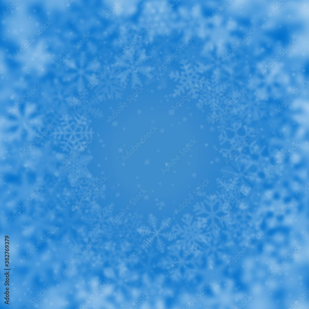 Christmas background of snowflakes of different shape, blur and transparency, arranged in a circle, on light blue background