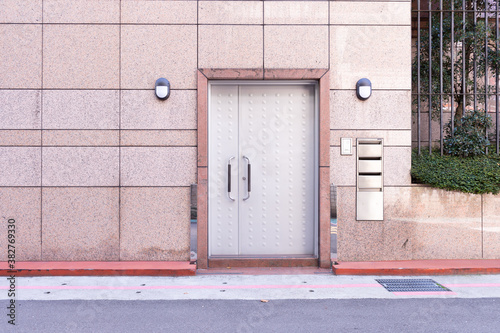 sidewalk by street wall & door