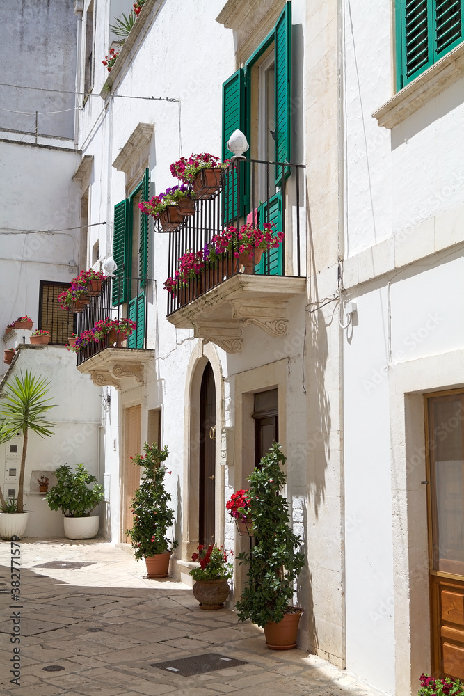 Fototapeta premium Locorotondo, street in the center, Apulia, Italy