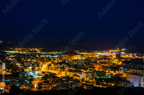 Illuminated cityscape of Muscat, Oman. Long Exposure Photography. © rejittiachan