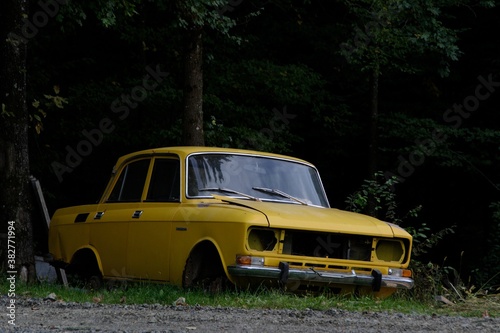 old yellow car in the park