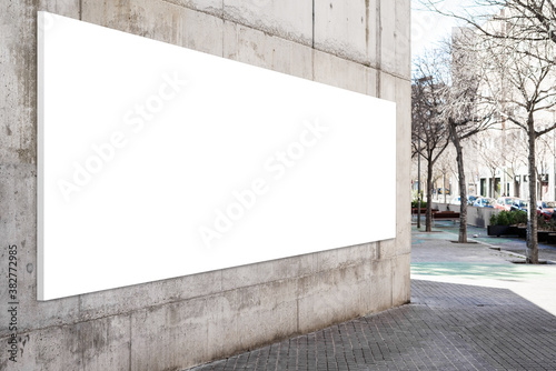 Blank billboard on the wall of building