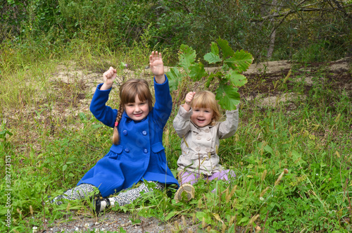 caucasian children in autumn forest