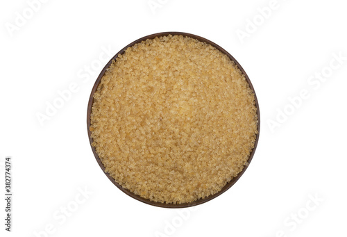Sugar in natural wooden bowl isolated on white background, top view