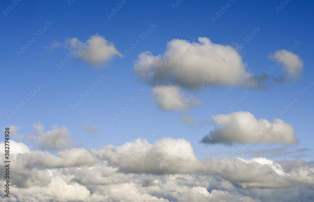 white fluffy clouds on blue sky in summer white fluffy clouds on blue sky in summer