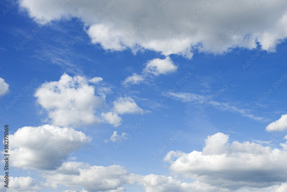 white fluffy clouds on blue sky in summer white fluffy clouds on blue sky in summer