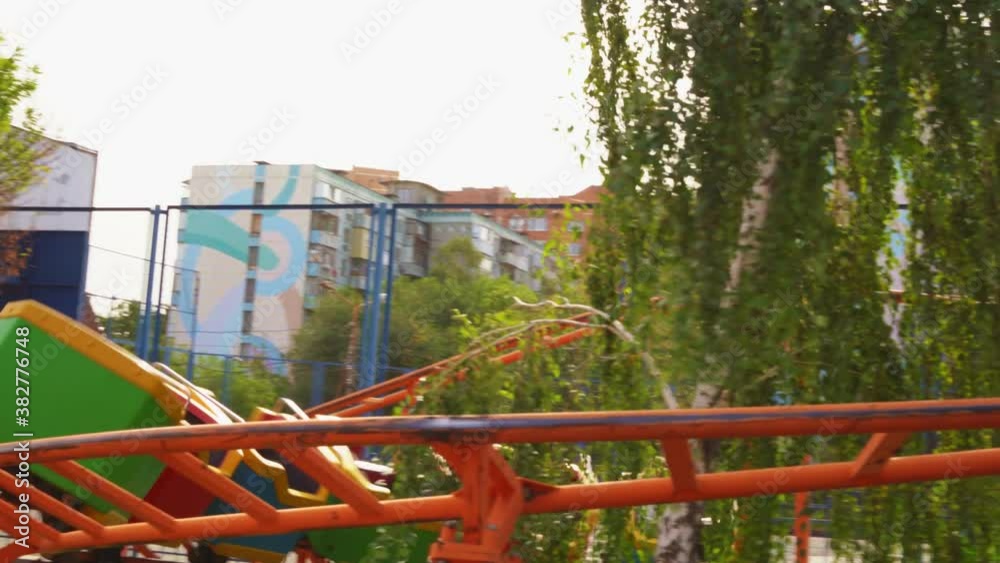 slow motion. roller coaster. car with girls rides on rails in amusement Park slow motion. roller coaster. car with girls rides on rails in amusement Park