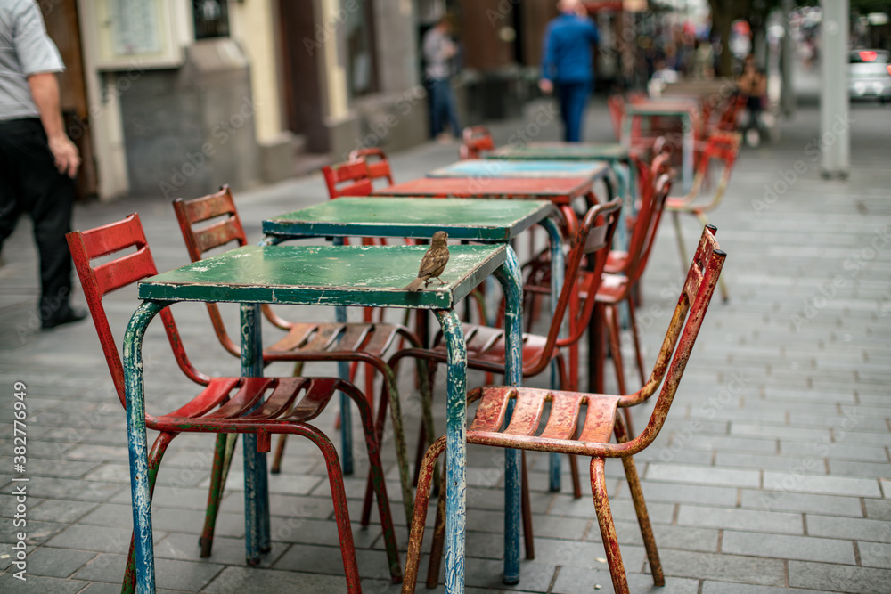 Flowers tables and chairs of an outdoor cafe in europe Flowers tables and chairs of an outdoor cafe in europe