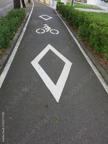 a sign for bike trail on the street © YENTING