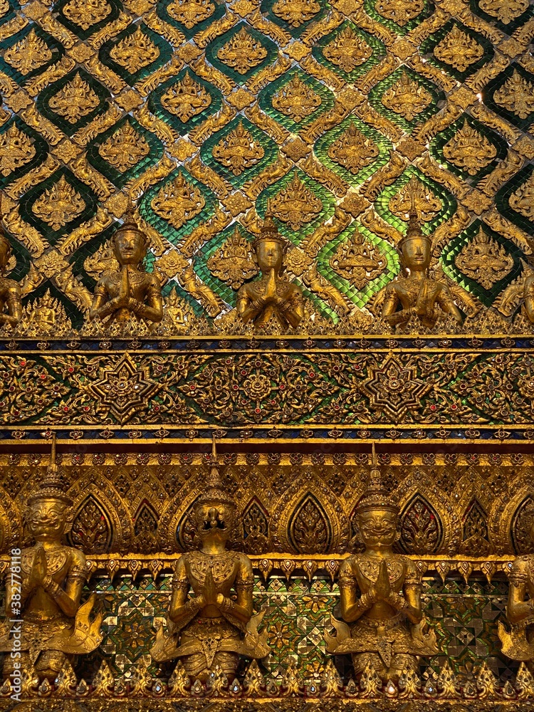 Temple walls gold tiles full frame close up detail