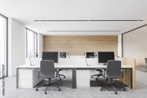 Modern white and wooden workplace in open space office