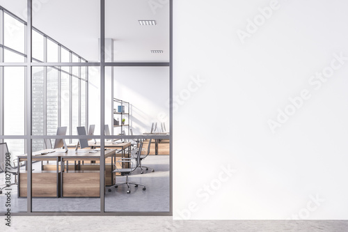 Mock up wall in modern white open space office