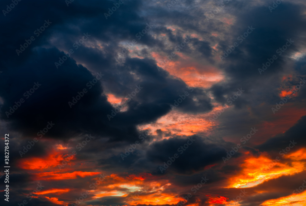 Beautiful sunset. Red and black clouds in the sky